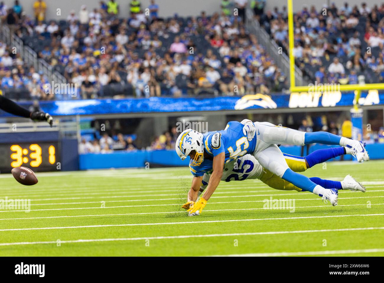 Los Angeles, California, USA. 17th Aug, 2024. Los Angeles Rams defensive back Jason Taylor II #25 defects a pass intended for Los Angeles Chargers wide receiver Leon Johnson #35 during an NFL football pre-season game at SoFi Stadium, Saturday, Aug. 17, 2024, in Inglewood, Calif. (Credit Image: © Ringo Chiu/ZUMA Press Wire) EDITORIAL USAGE ONLY! Not for Commercial USAGE! Stock Photo