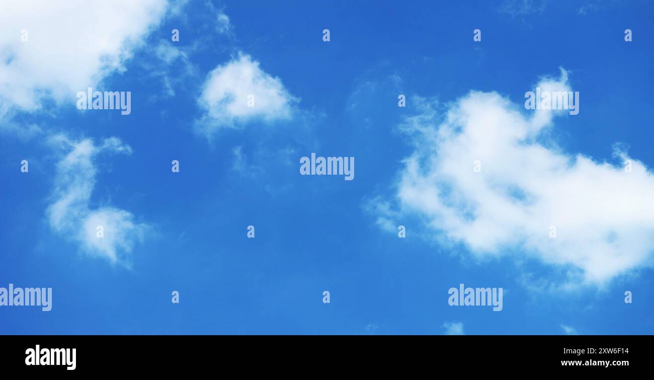 Pure White Clouds Floating on Vivid Blue Sky Stock Photo