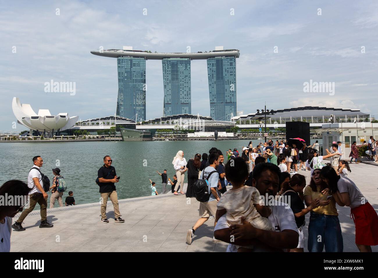 Marina Bay Sands stands as a premier attraction in Singapore, drawing tourists from around the world with its iconic skyline, luxurious accommodations Stock Photo