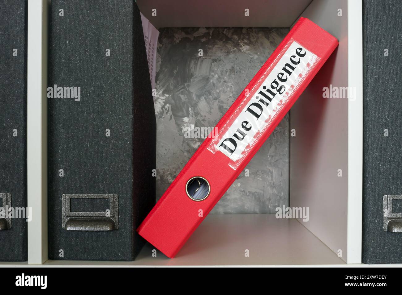 Folder on a shelf with a Due Diligence label Stock Photo - Alamy