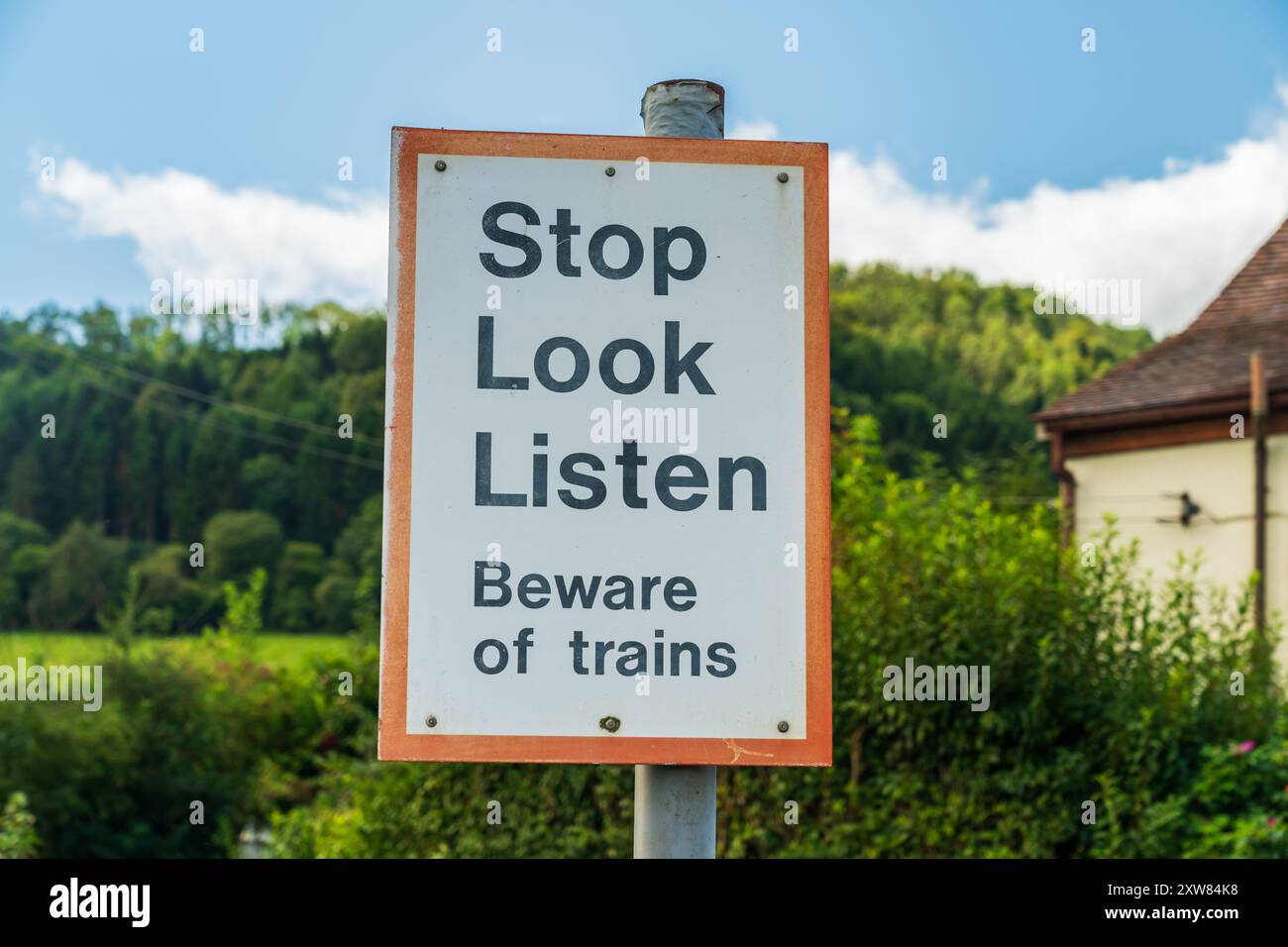 UK Traffic sign advising to be aware and beware of the trains Stock Photo