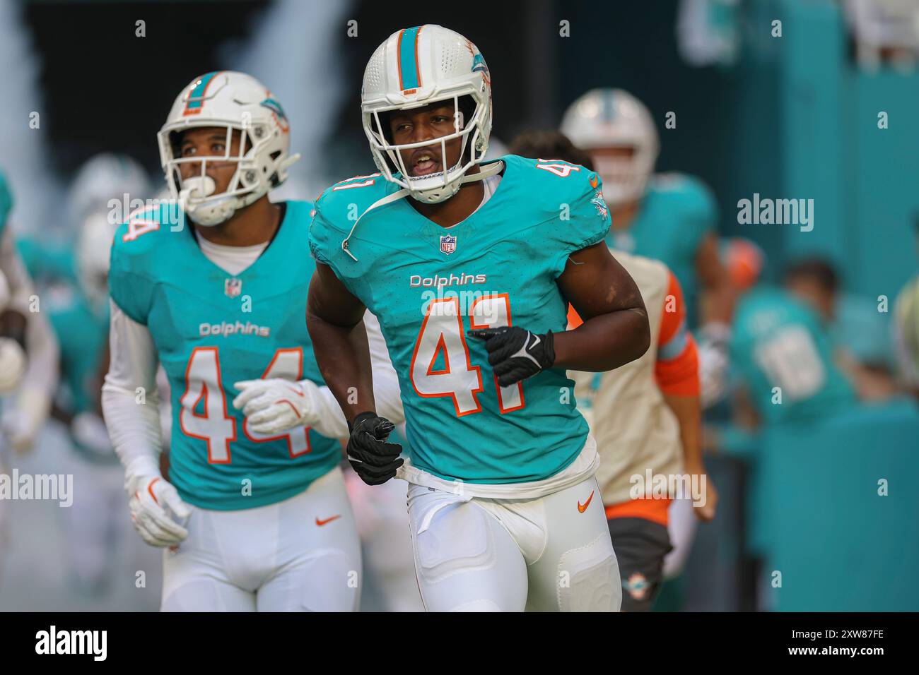 Miami Gardens, FL USA;  Miami Dolphins linebacker Channing Tindall (41) runs on the field prior to an NFL Preseason game against the Washington Comman Stock Photo