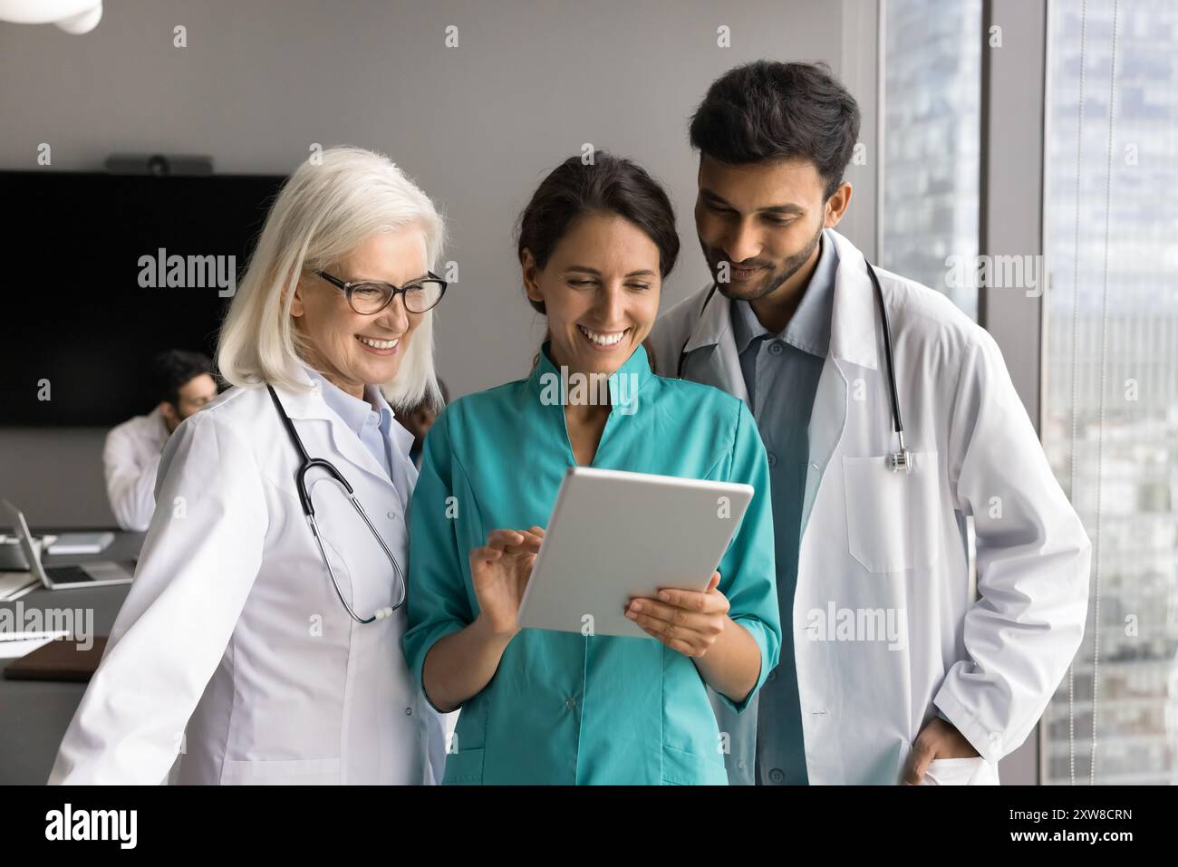 Smiling group of medical professionals hi-res stock photography and ...