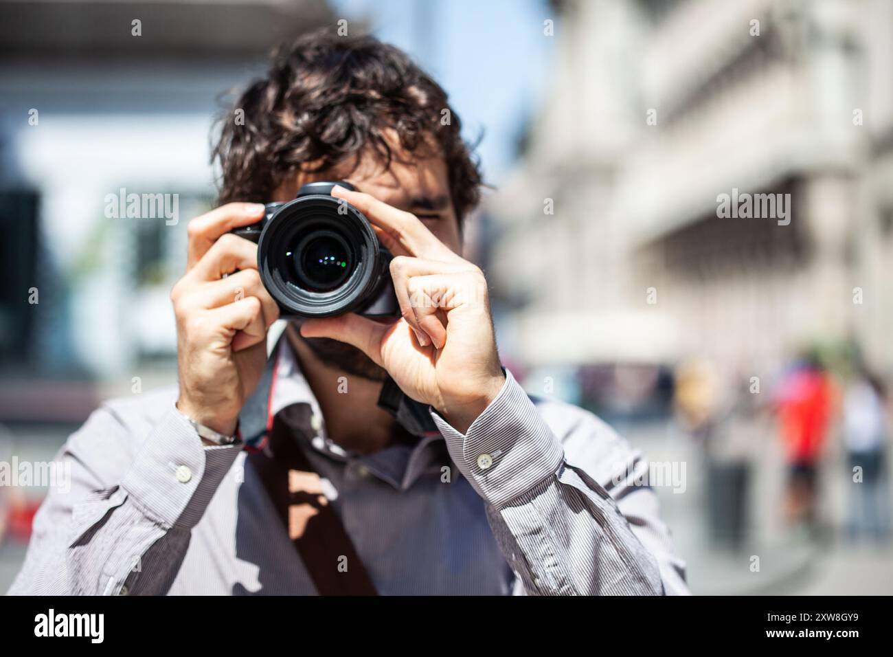 Pusle Using His Camera Smiling male photographer using hi-res stock photography and images - Alamy