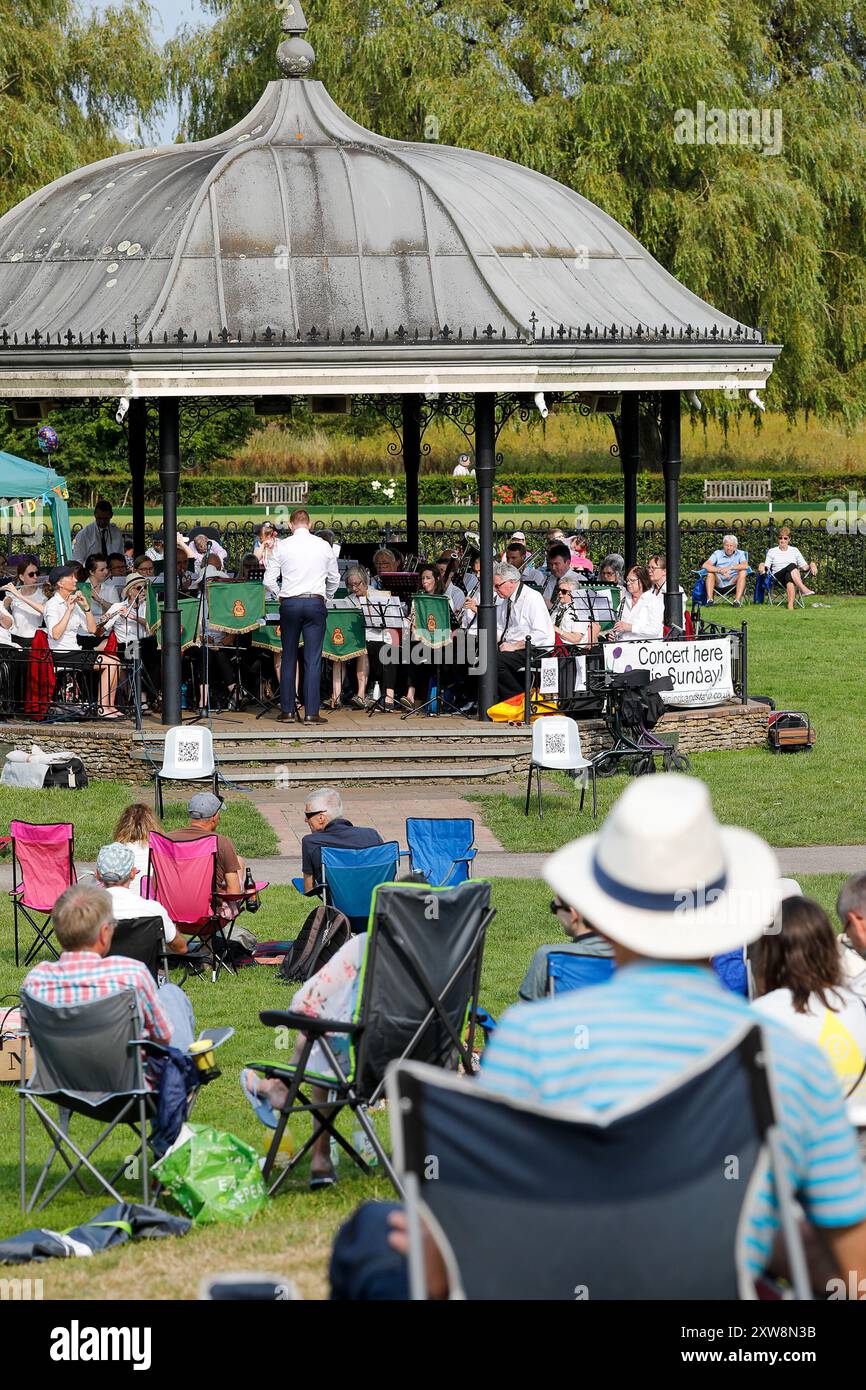 The Burys, Godalming. 18th August 2024. A warm and sunny afternoon for the Home Counties. People enjoying 'Music in the park' at Godalming Bandstand in Surrey. Every Sunday afternoon during the summer months, live music is performed with a variety of genres covered. This afternoon was the turn of 'The Band of the Surrey Yeomanry', sponsored by BL Vision of Farncombe. Credit: james jagger/Alamy Live News Stock Photo