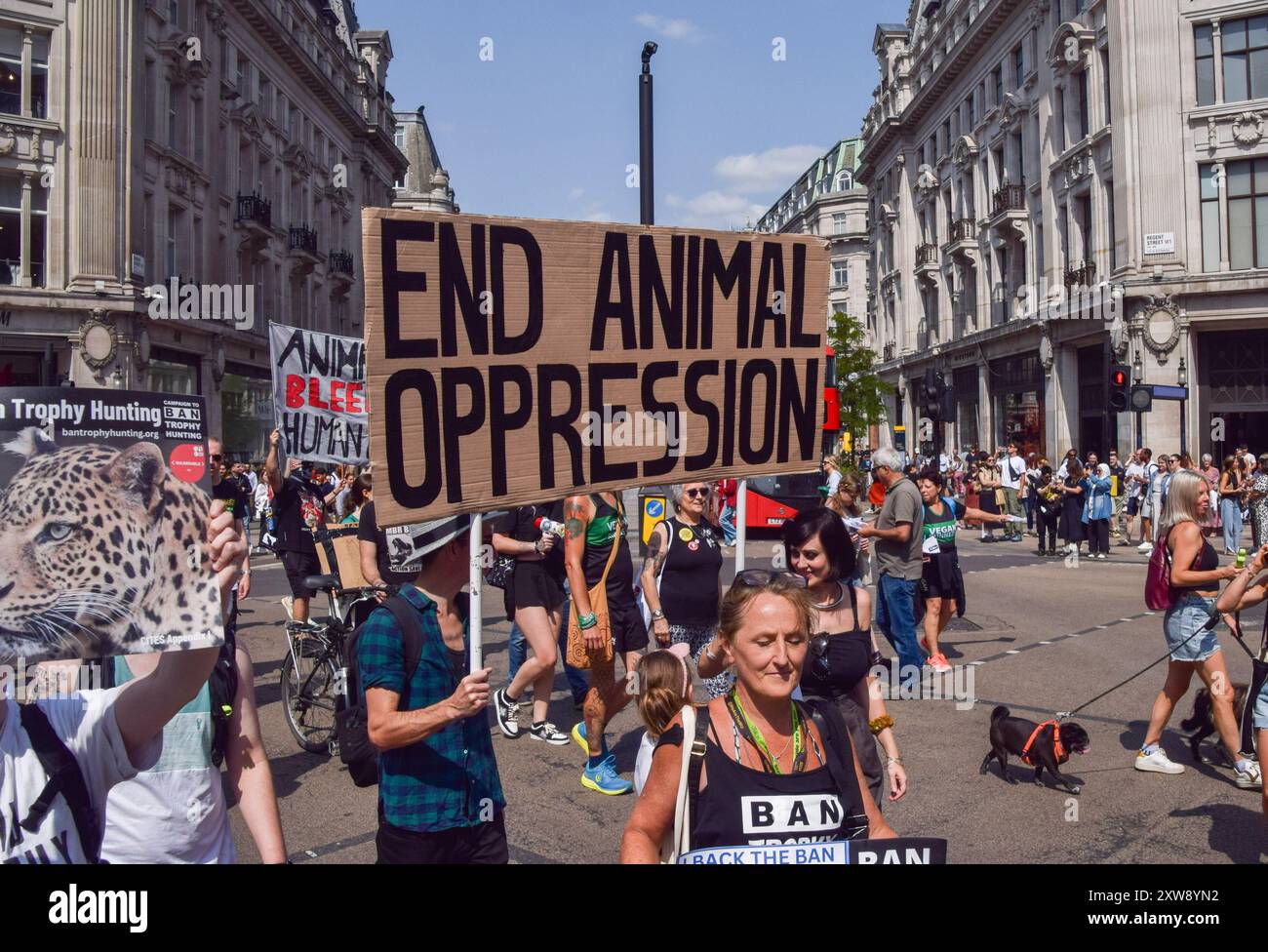 London, UK. 18th August 2024. Protesters pass through Oxford Circus ...