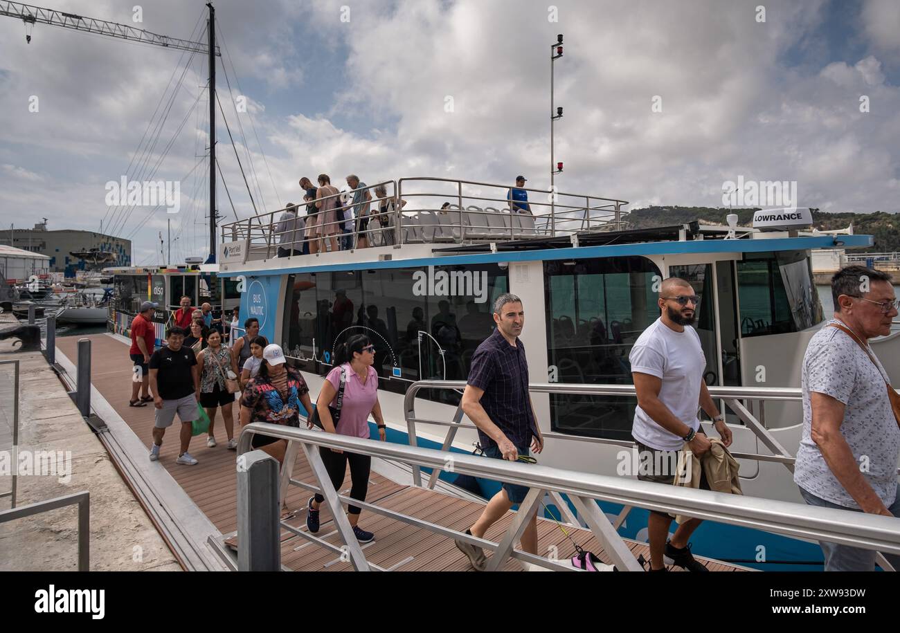 Barcelona, Spain. 18th Aug, 2024. Visitors are seen disembarking the new Nautical Bus service that connects the city centre with the regatta area. There are only 3 days and a few hours left until the Louis Vuitton 37th America's Cup starts racing. Barcelona has all the facilities and means of transport ready to host the major sporting event, which is expected to attract a large number of spectators. Credit: SOPA Images Limited/Alamy Live News Stock Photo