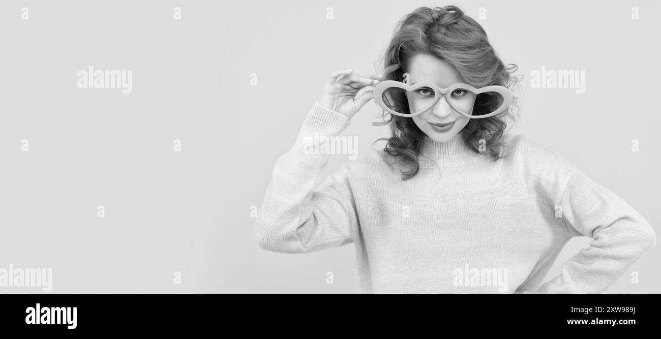 Girl with funny party glasses. Woman isolated face portrait, banner with copy space. feeling flirty. funny girl wear big glasses. birthday party Stock Photo