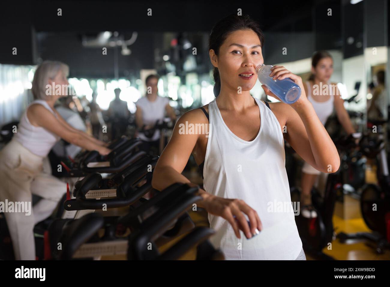 Japanese woman standing gym smiling hi-res stock photography and images ...