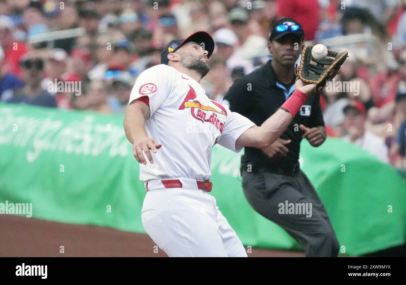 St. Louis, United States. 18th Aug, 2024. St. Louis Cardinals first baseman Paul Goldschmidt makes a catch in foul territory on a ball off the bat of Los Angeles Dodgers Kevin Kiermaier in the second inning at Busch Stadium in St. Louis on Sunday, August 18, 2024. Watching the action is first base umpire Edwin Moscoso. Photo by Bill Greenblatt/UPI Credit: UPI/Alamy Live News Stock Photo