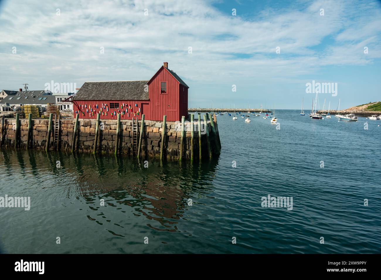 Motif 1 in New England with lobster buoys on red wall Stock Photo
