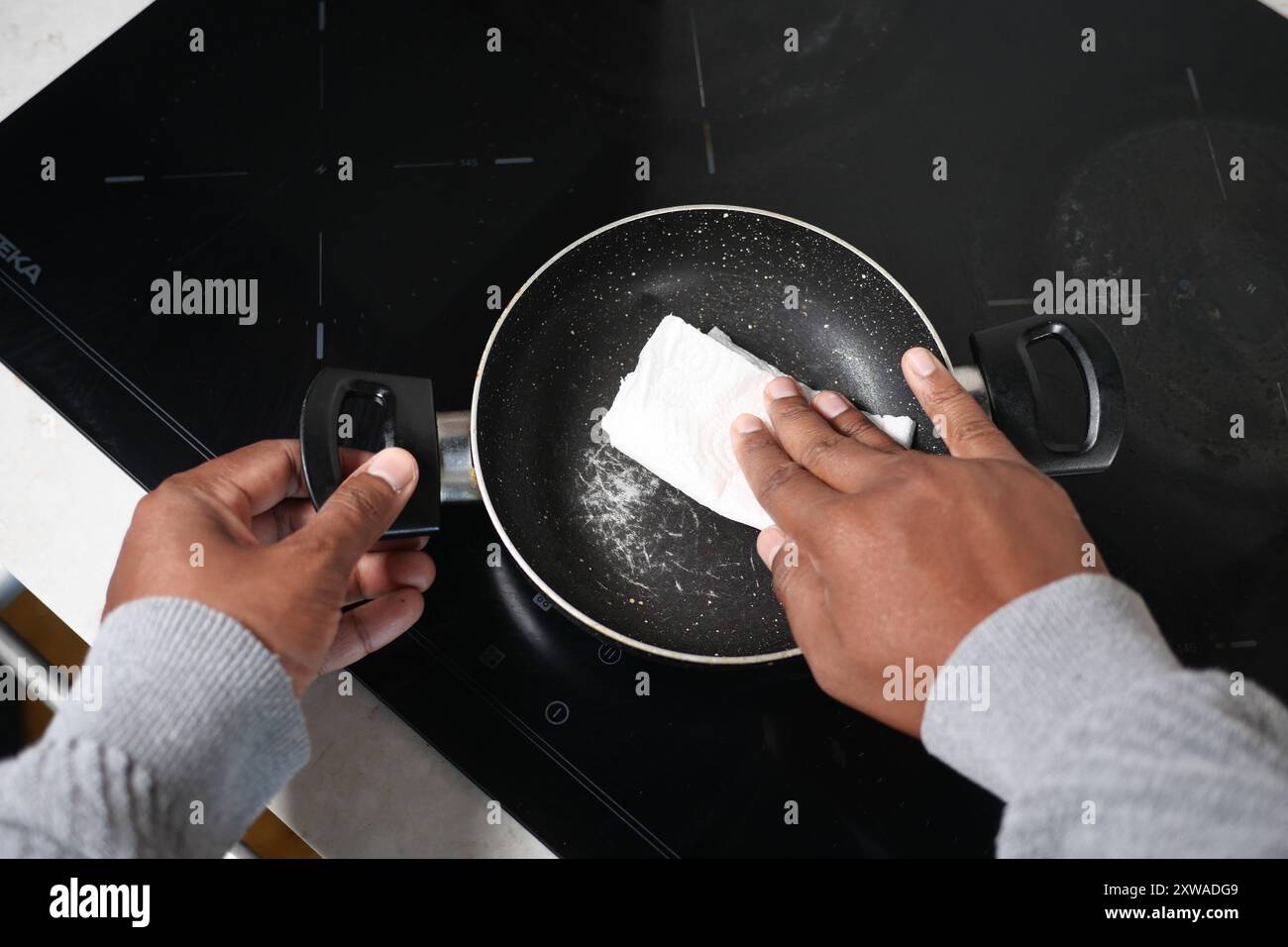 It is important to clean a nonstick pan with utmost care to maintain its quality Stock Photo
