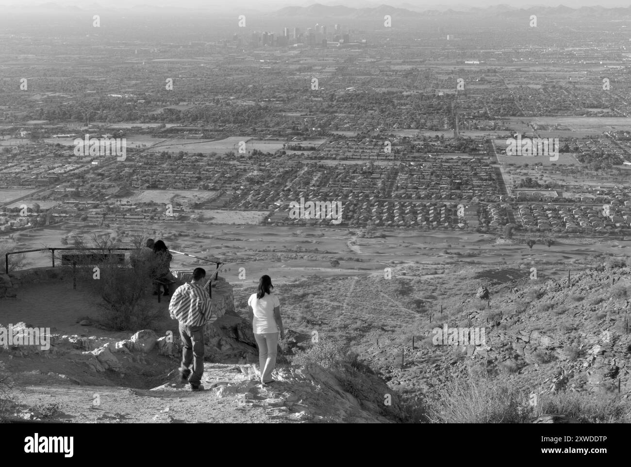 A young Caucasian couple checking out the view at Dobbins Lookout in South Mountain Park, Phoenix, Arizona. USA. Stock Photo