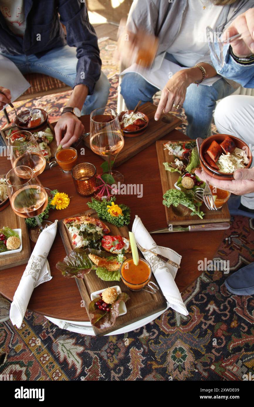 Swedish tapas enjoyed by friends at outdoor dinner Stock Photo