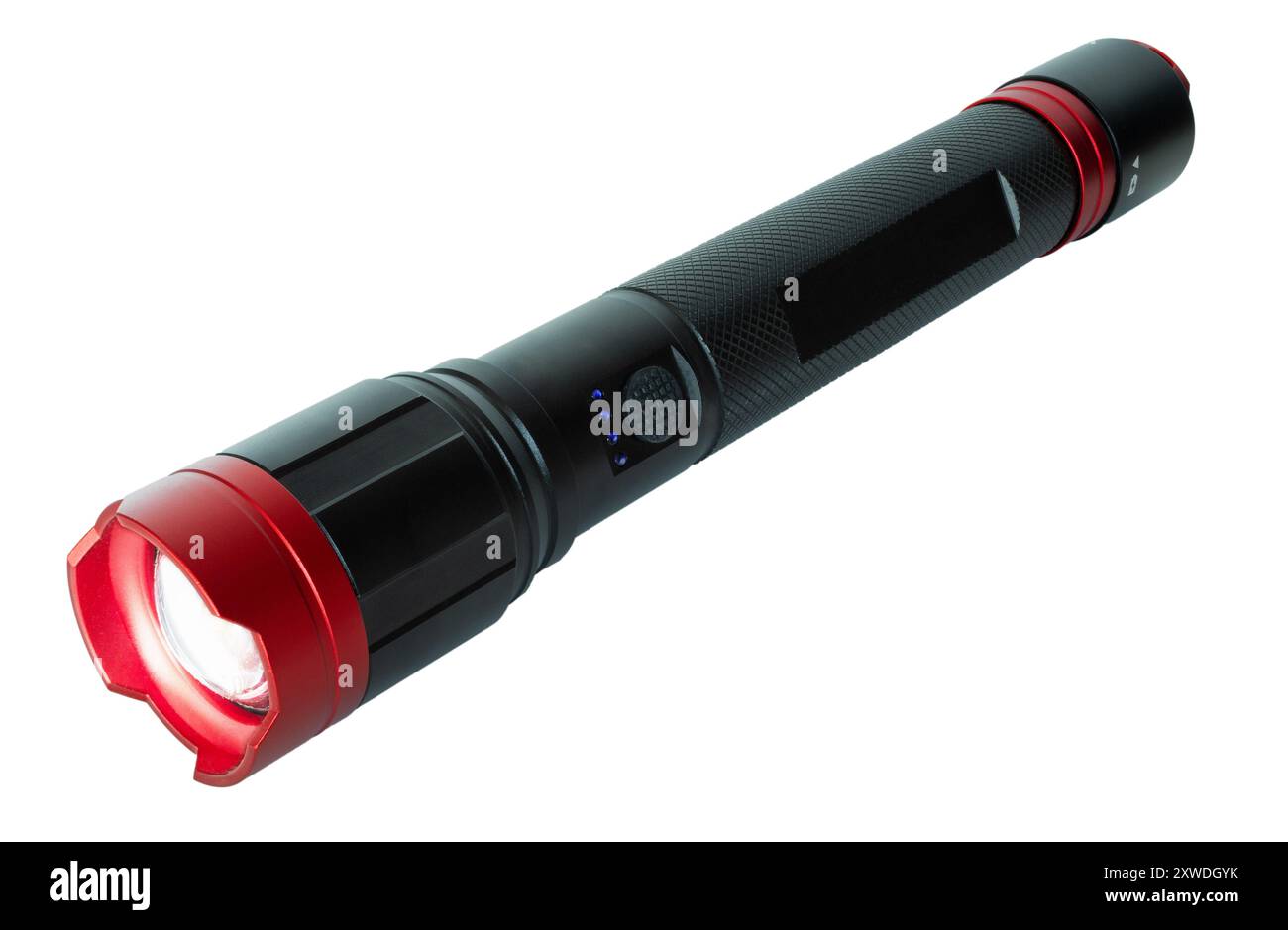 Black and red flashlight with full metal body with the LED up front glowing bright and blue LEDs by the on and off switch showing the battery is full. Stock Photo