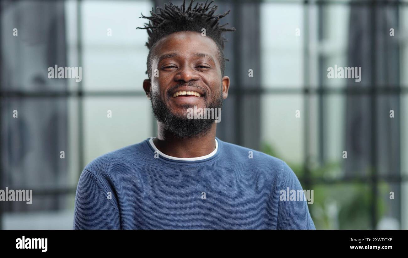 Serious black african man standing hi-res stock photography and images ...