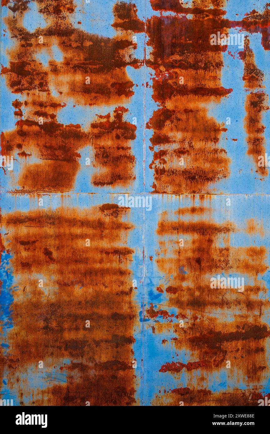 Rusty pattern on blue metal door Stock Photo