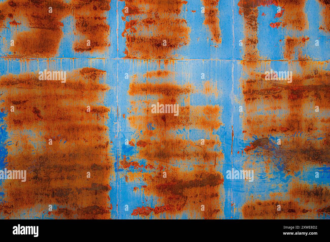 Rusty pattern on blue metal door Stock Photo
