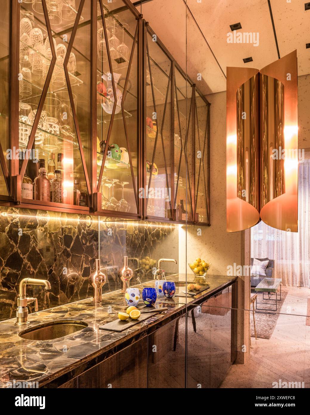 Marble wash basins with glass fronted cabinets in luxury modern British home in London, UK Stock Photo