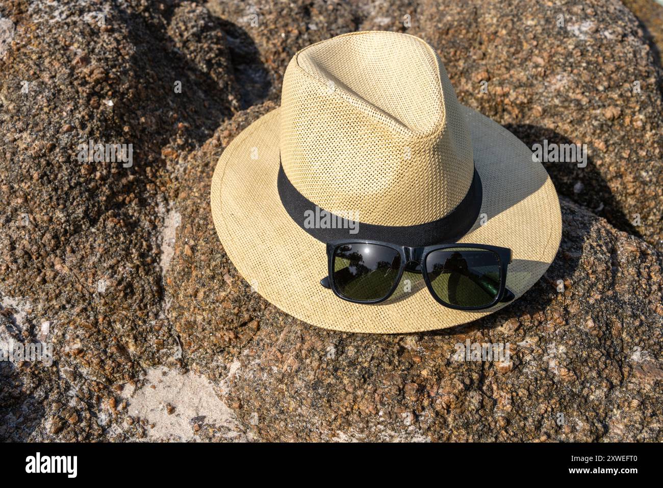 Straw hat and sunglasses on the beach. Beach holiday concept Stock ...