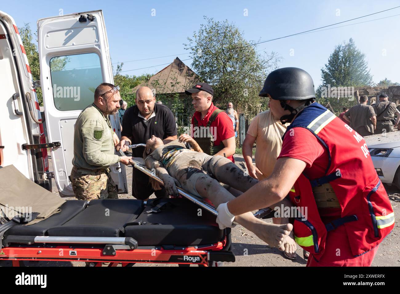 Woman taken away on stretcher hi-res stock photography and images - Alamy