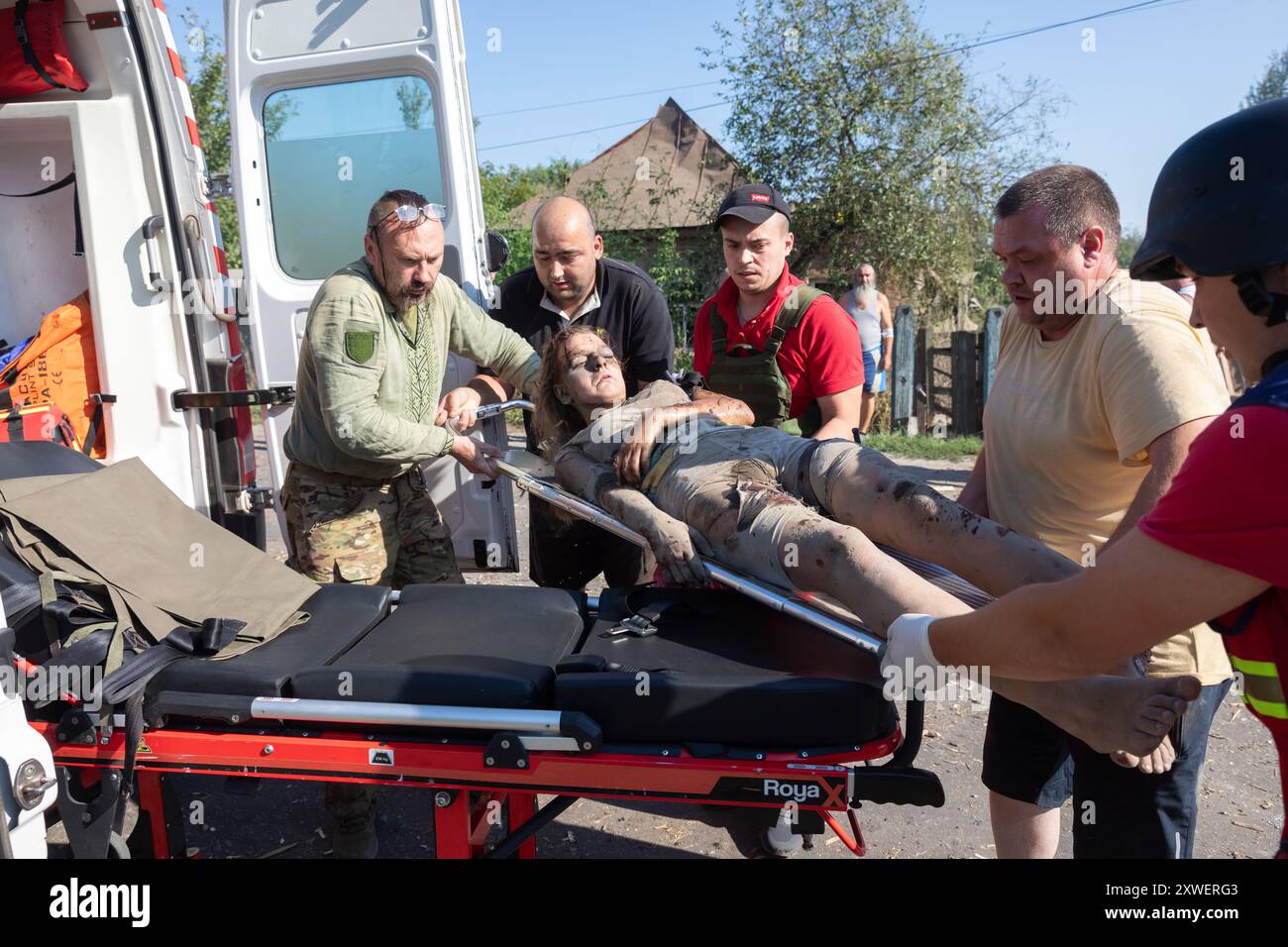 Woman taken away on stretcher hi-res stock photography and images - Alamy