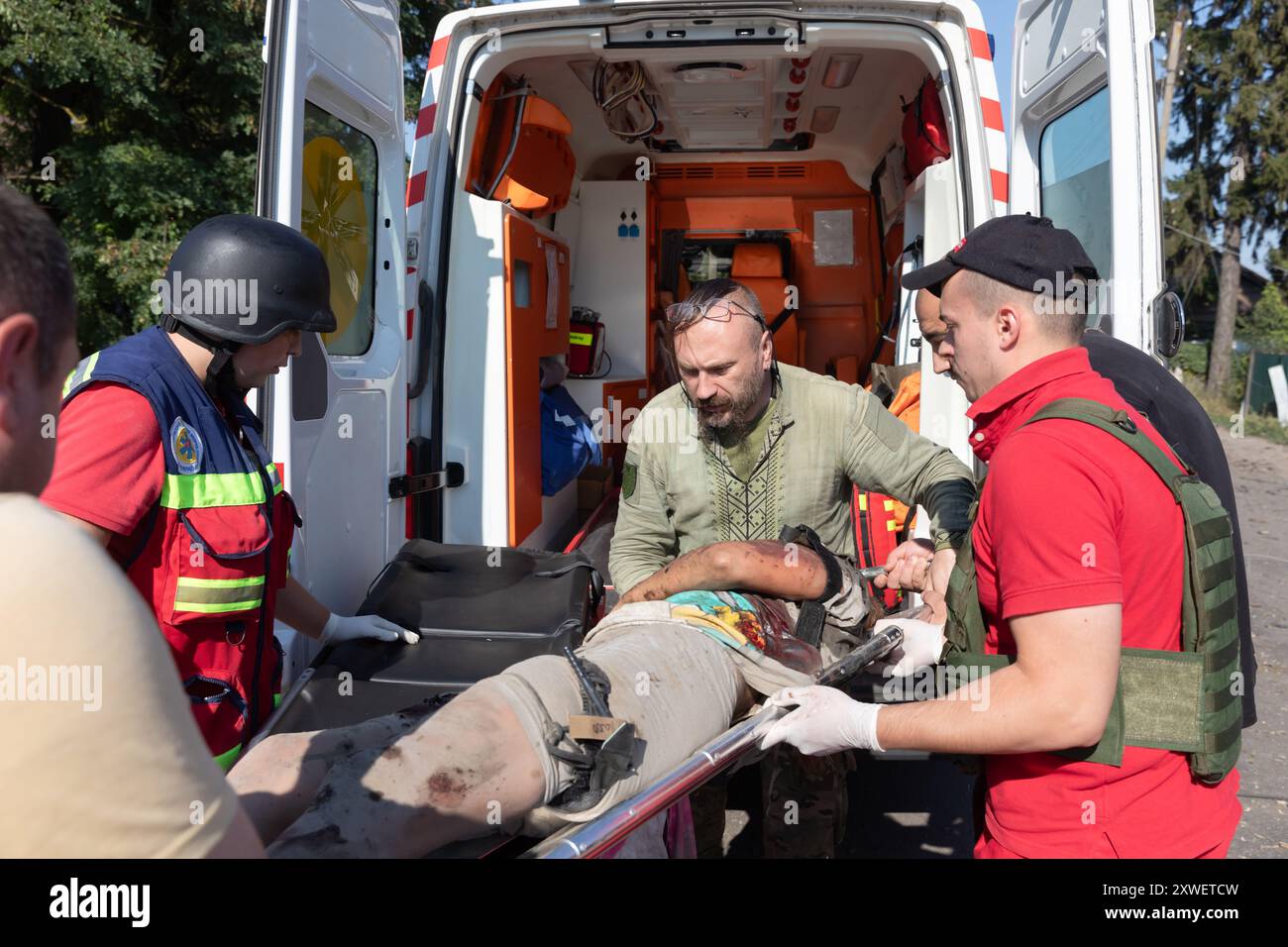 Woman taken away on stretcher hi-res stock photography and images - Alamy
