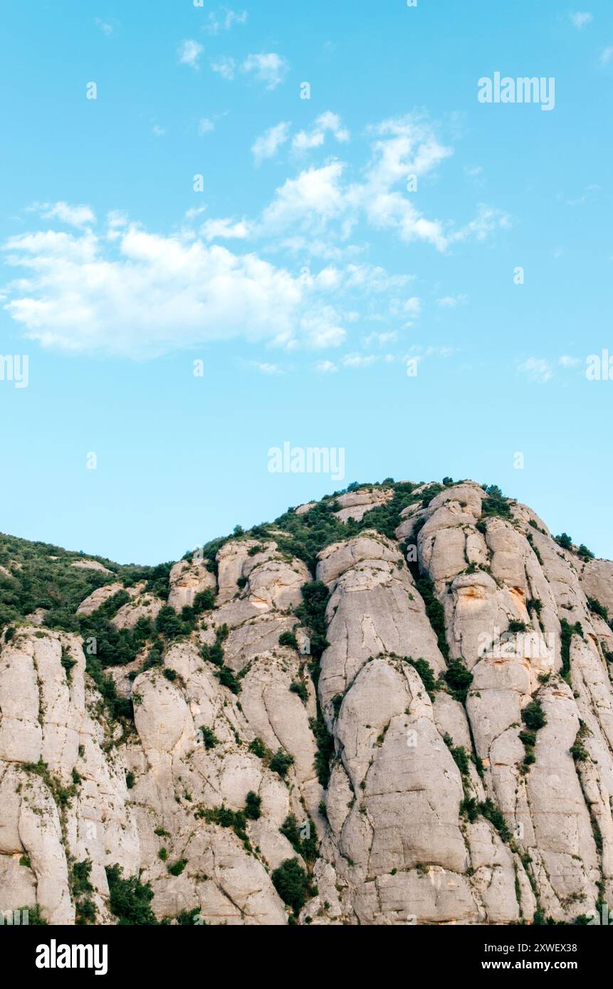Majestic towering mountain peaks under a vibrant clear blue sky Stock ...