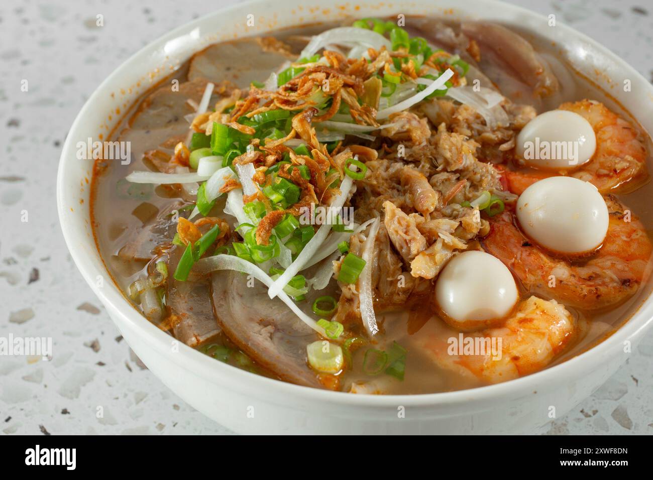 A closeup view of a bowl of banh canh tom cua Stock Photo - Alamy