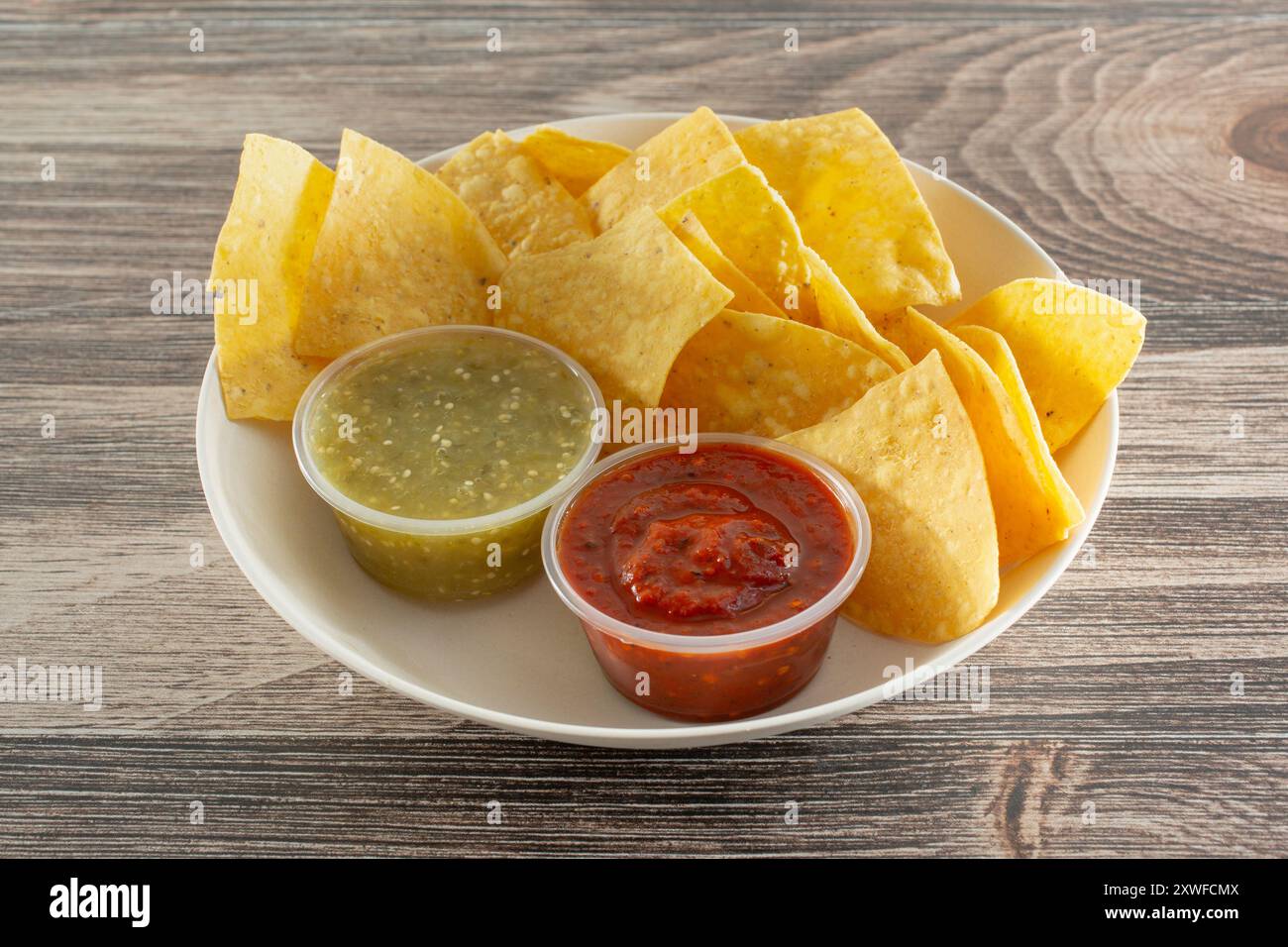A view of a bowl of chips and salsa. Stock Photo