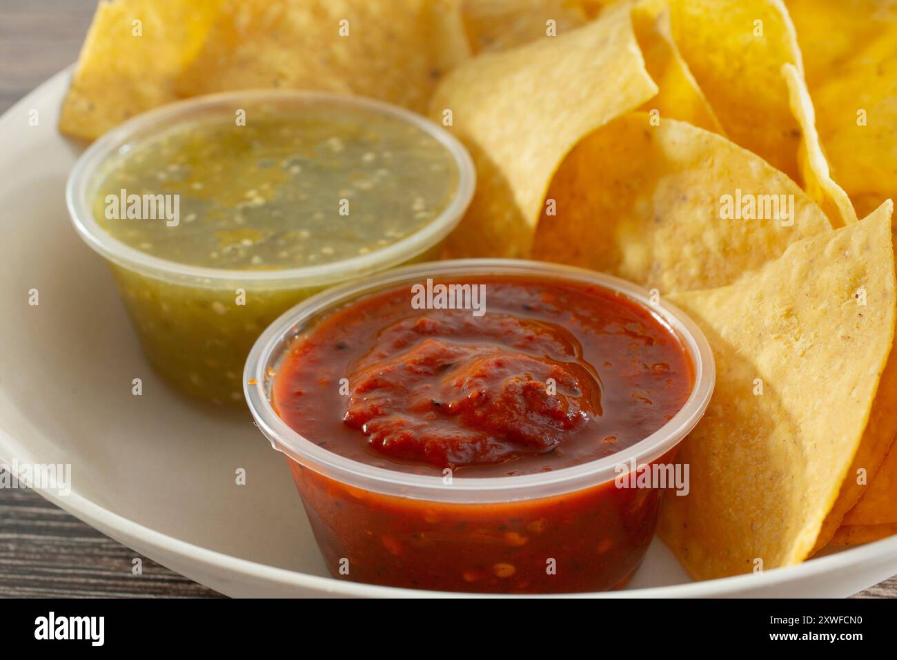 A closeup view of a bowl of chips and salsa. Stock Photo