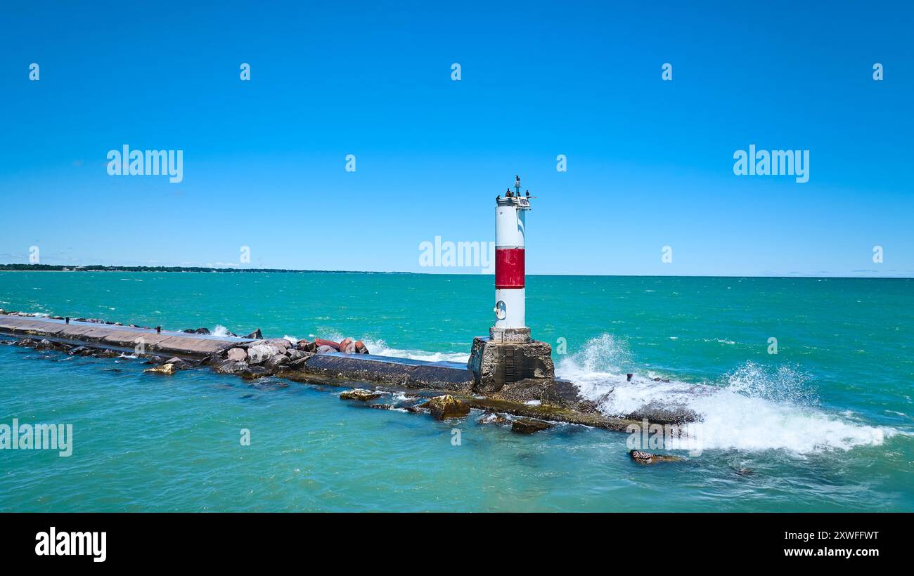 Aerial Fly Over Kenosha Lighthouse and Breakwater on Lake Michigan Stock Photo