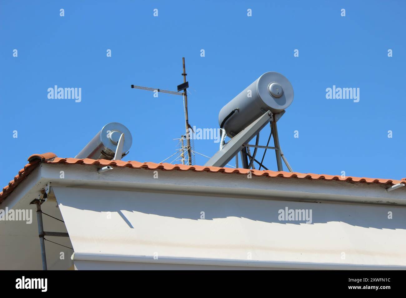 Solar water heater on roof top Stock Photo - Alamy