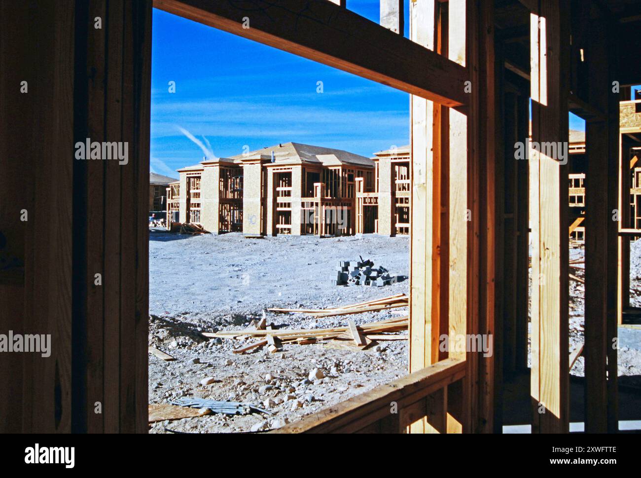 A partially constructed building with wooden framing, with a view of ...