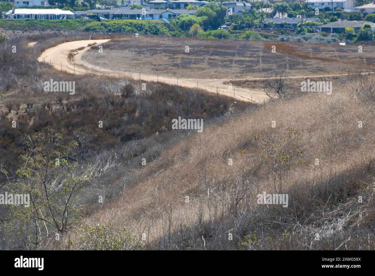 brown terrain hill with dirt hiking path Stock Photo