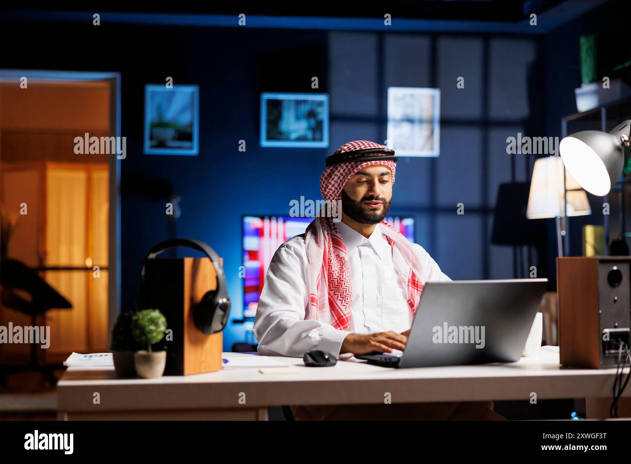 Arab man using laptop typing hi-res stock photography and images - Alamy