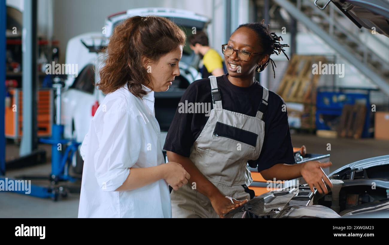 Skilled technician assisting customer hi-res stock photography and ...