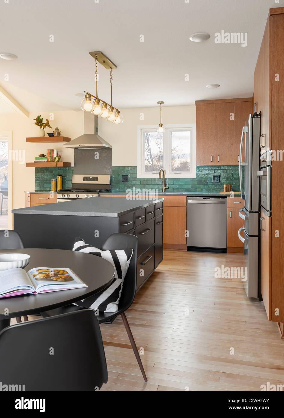 Kitchen with white oak cabinets and dark green backsplash tile and ...
