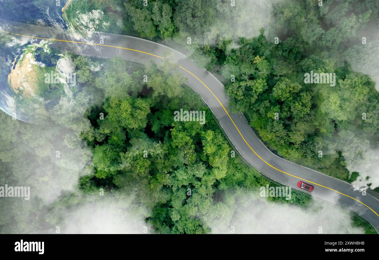 Aerial top view of a red car driving on highway road in green forest ...