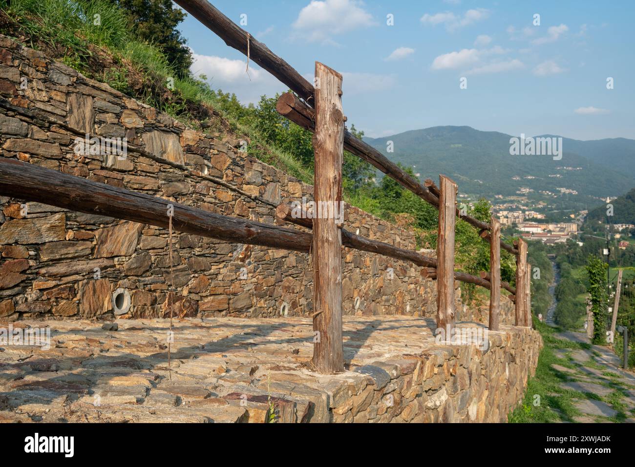 handrail for mountain path, detail of wooden fence with poles with ...