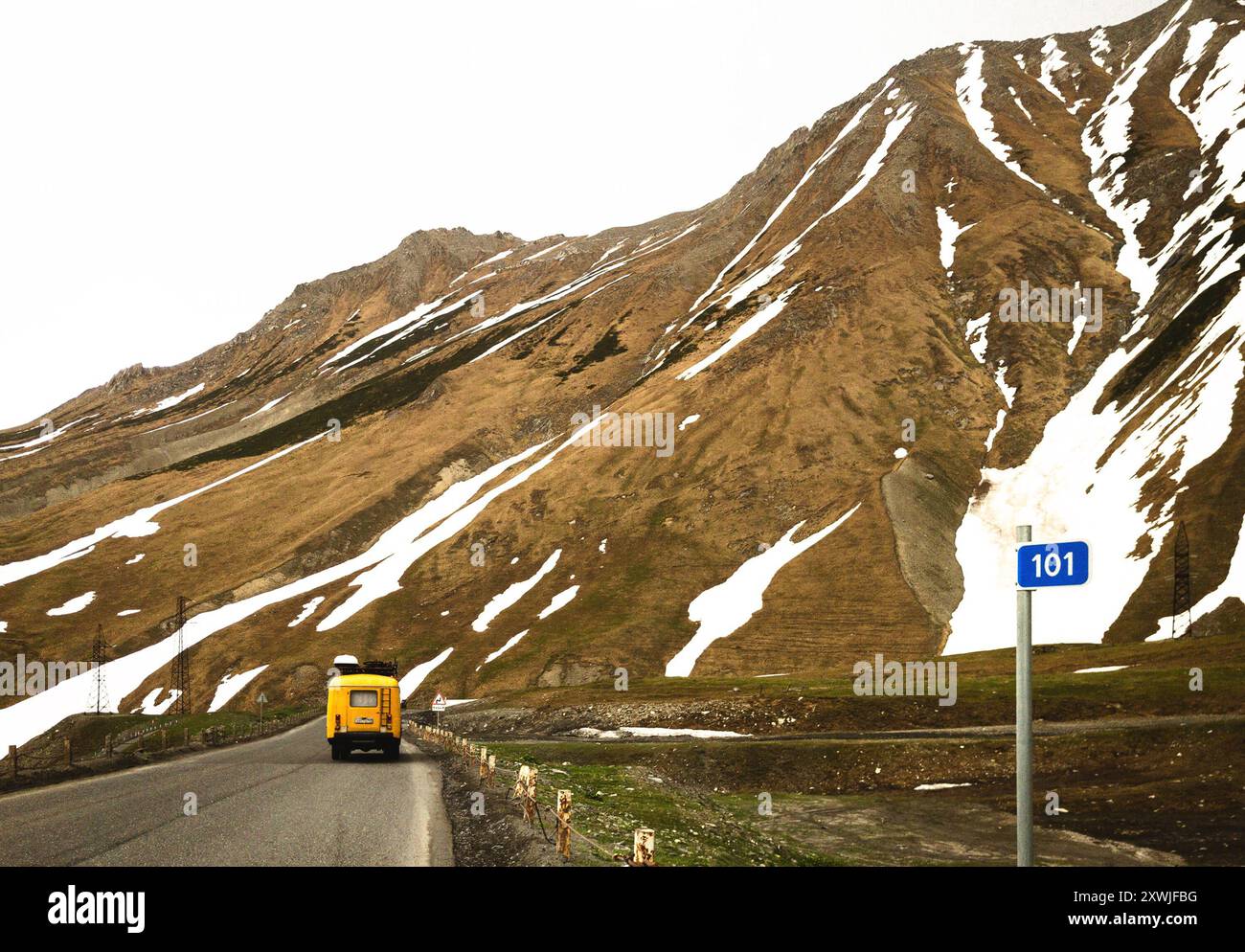 lone old bus in mountain road Stock Photo