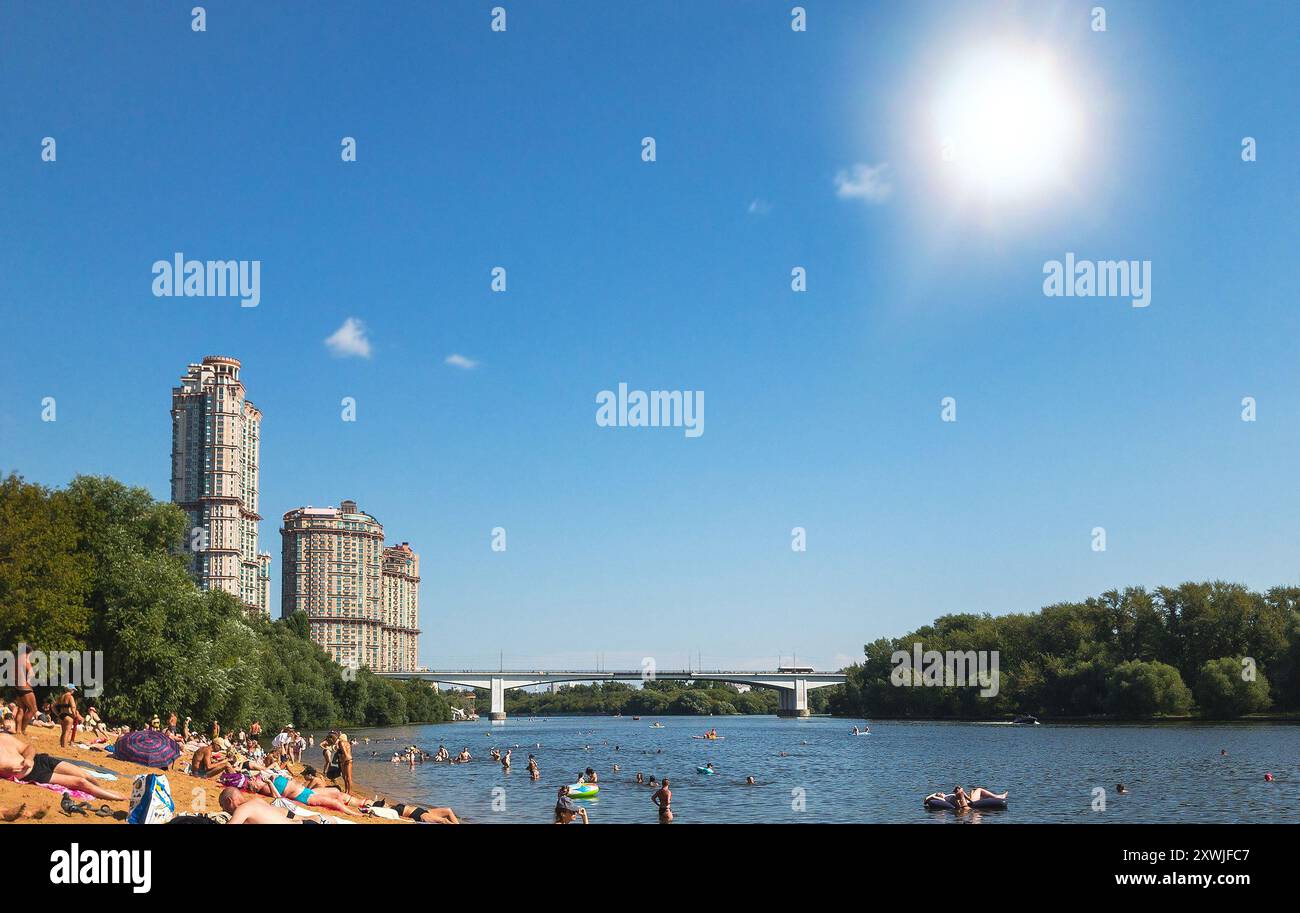 Sunny day on crowded beach hi-res stock photography and images - Alamy