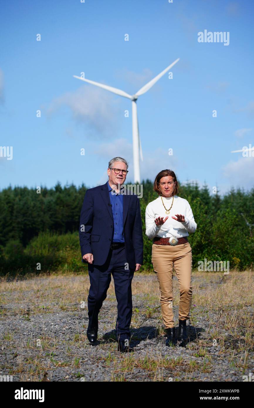 Prime Minister Sir Keir Starmer and First Minister of Wales Eluned Morgan during a visit to Brechfa Forest West Wind Farm, a clean energy site in Pencader, South Wales, as Labour pledges to work closely on realising the benefits of a publicly-owned energy company. GB Energy, which has been allocated £8.3 billion of funding over the next five years, has been tasked with developing future offshore wind projects as part of moves to hasten the UK's transition to renewable energy. Picture date: Tuesday August 20, 2024. Stock Photo