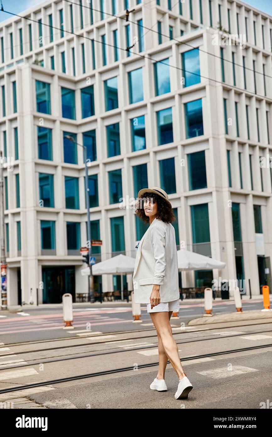 Woman walks across pedestrian hi-res stock photography and images - Alamy