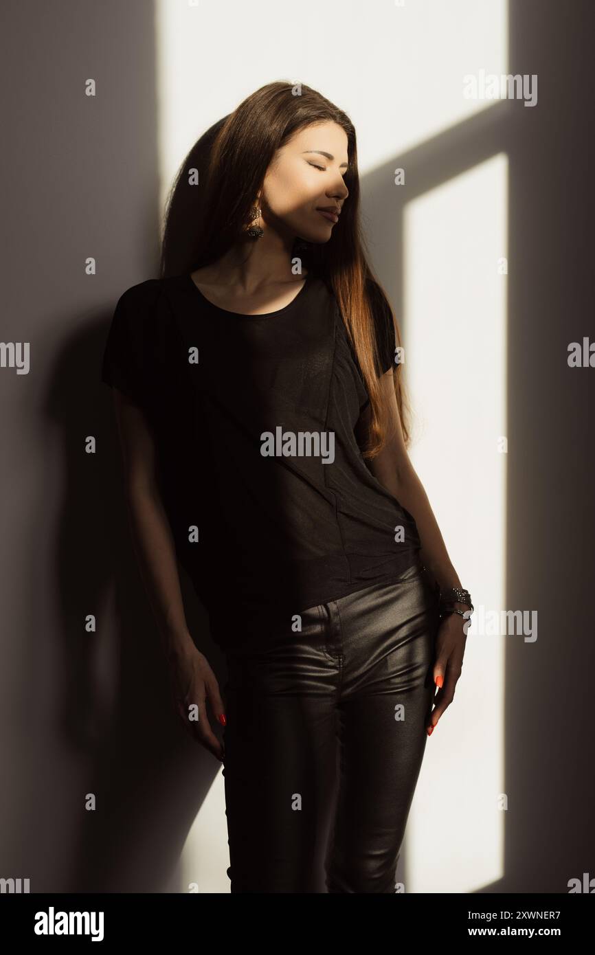 Black woman in leather pants hi-res stock photography and images - Alamy