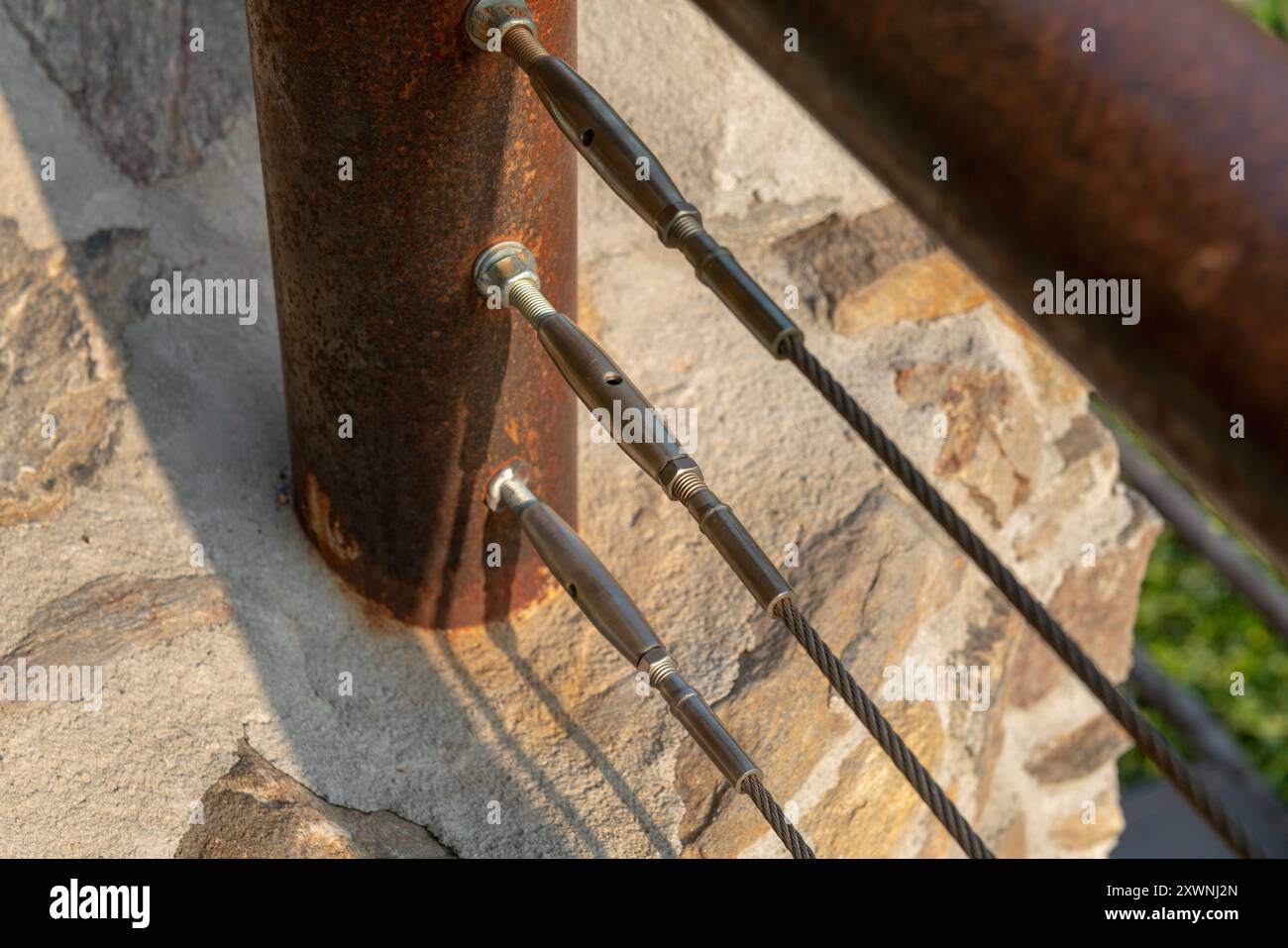 detail of the stainless steel rope railing offers safety and modern ...