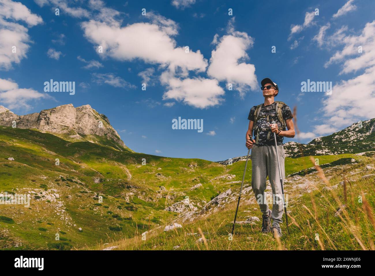 Male traveler trekking poles hi-res stock photography and images - Alamy