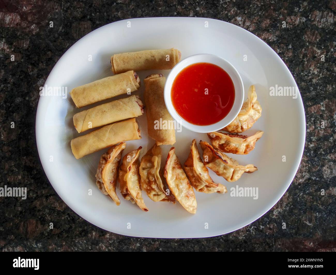 Egg rolls and gyoza at a restaurant Stock Photo