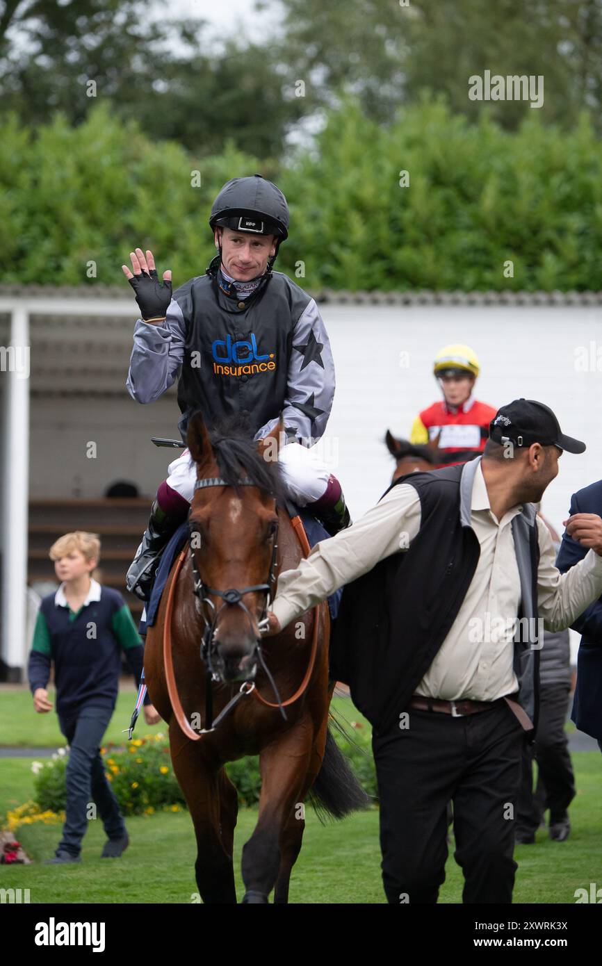 Windsor, Berkshire, UK. 19th August, 2024.  LUCKY MAN ridden by jockey Oisin Murphy wins the Get The Inside Track With Raceday-Ready.com Handicap Stakes (Class 4) at Royal Windsor Racecourse in Windsor, Berkshire at the Monday Night Races Final Fiesta race meeting. Owner Rebel Racing Premier IV, Trainer Richard Spencer, Newmarket, Breeder Rathbarry Stud, Sponsor Direct Commercial Ltd. Credit: Maureen McLean/Alamy Live News Stock Photo