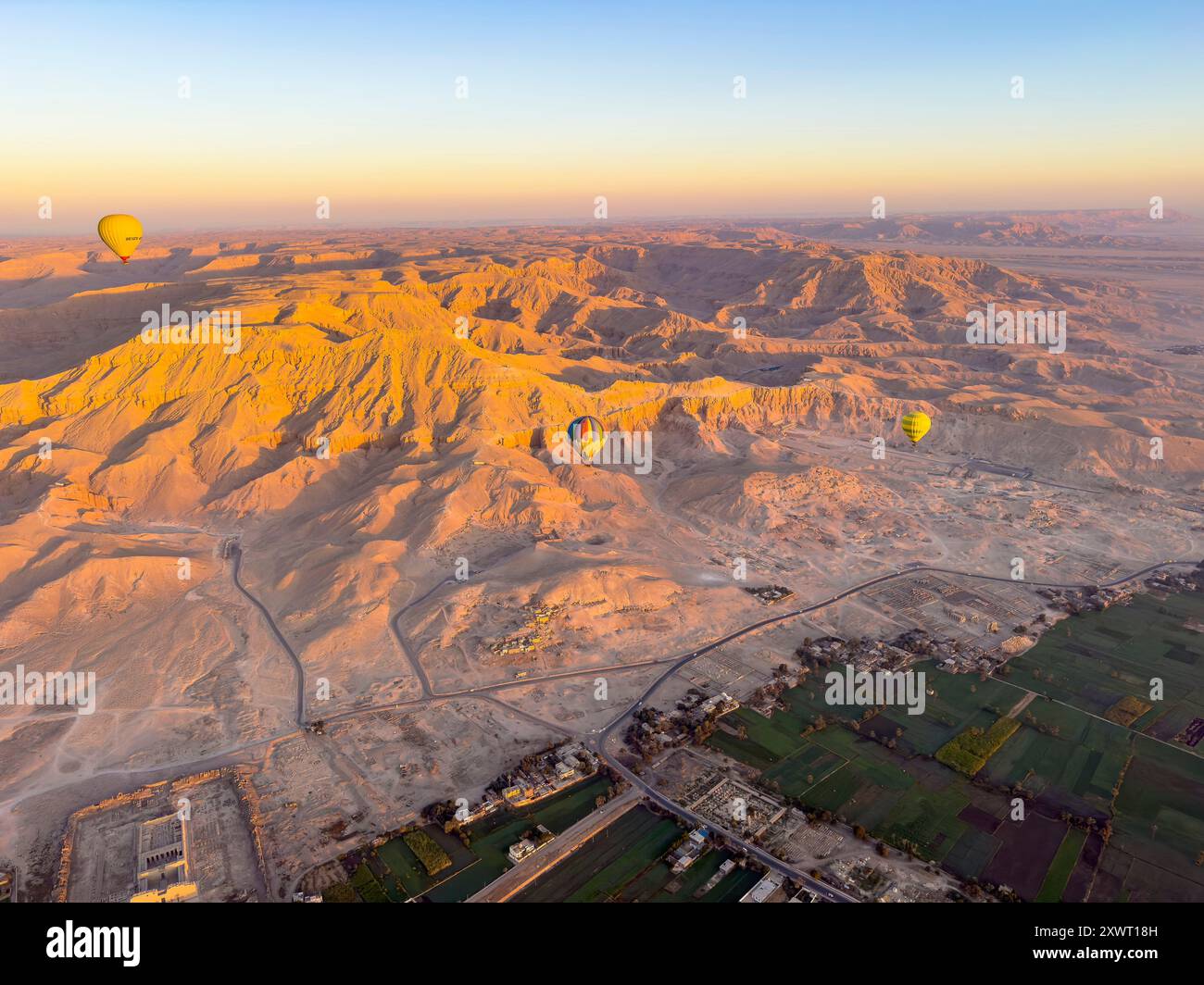 Embark on a breathtaking hot air balloon adventure over Luxor's Nile Valley and witness the ancient wonders of Thebes from a unique aerial perspective Stock Photo